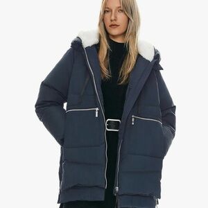 Orolay Women's Dark Blue Puffer Coat with White trim.